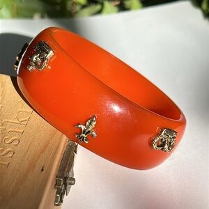 Rare Bakelite Orange Bangle Bracelet with Fleur de Lis Crowns Gold Accents